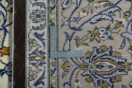 Backside of handmade 2000s Kashan rug showing knot structure and weave density