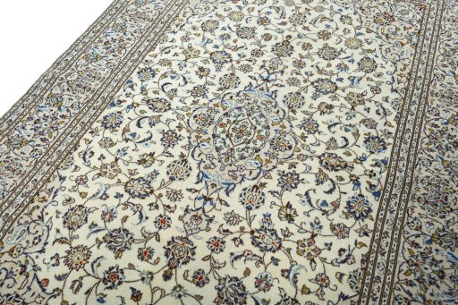 Backside of handmade 2000s Kashan rug showing knot structure and weave density