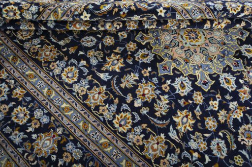 Close-up detail of 2000s Kashan rug from Iran / Persia showing Wool weave
