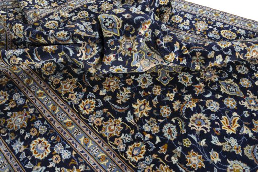 Surface texture of 2000s Kashan rug with natural Wool and intricate pattern