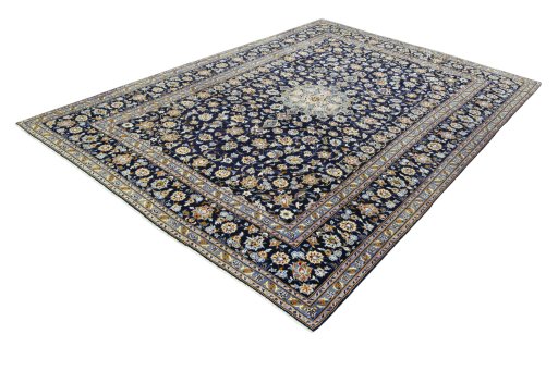 Corner detail of 2000s Kashan rug showing border pattern and Wool pile