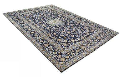 Close-up detail of 2000s Kashan rug from Iran / Persia showing Wool weave