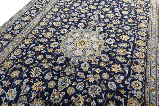 Backside of handmade 2000s Kashan rug showing knot structure and weave density