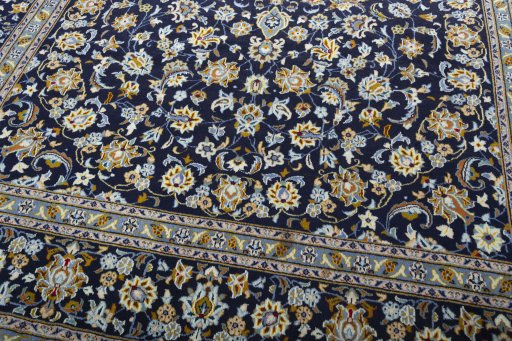 Close-up detail of 2000s Kashan rug from Iran / Persia showing Wool weave