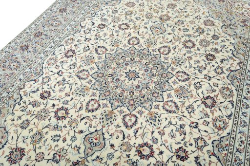 Backside of handmade 2000s Kashan rug showing knot structure and weave density