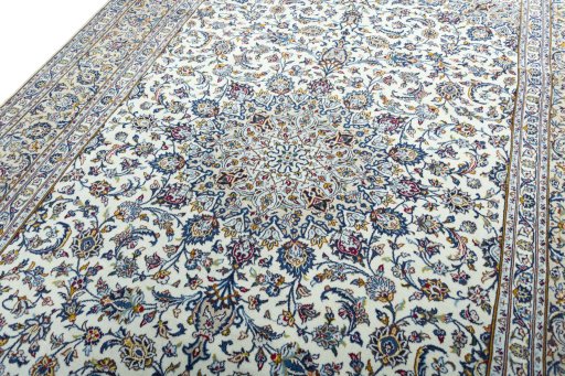 Backside of handmade 2000s Kashan rug showing knot structure and weave density