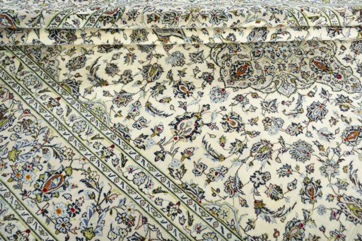 Close-up detail of 2000s Kashan rug from Iran / Persia showing Wool weave