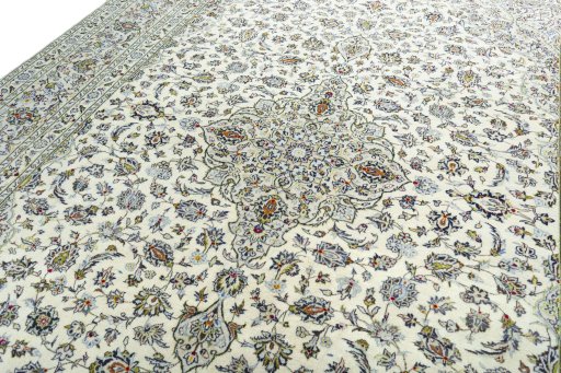 Backside of handmade 2000s Kashan rug showing knot structure and weave density