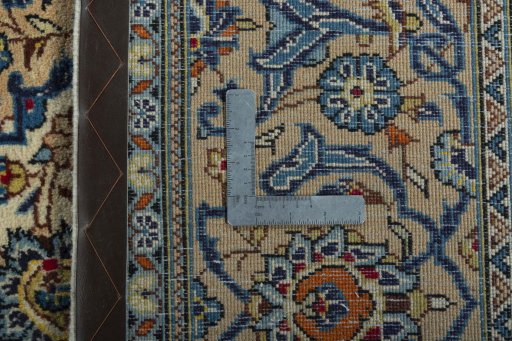Backside of handmade 2000s Kashan rug showing knot structure and weave density