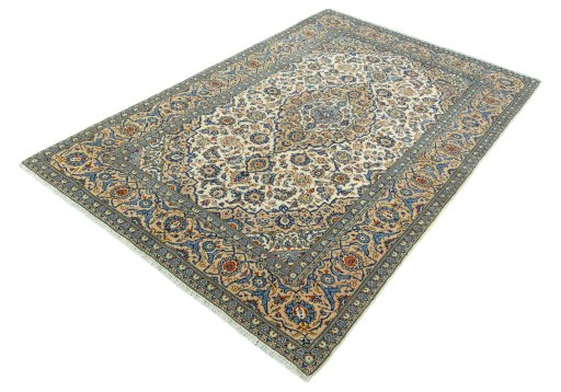 Corner detail of 2000s Kashan rug showing border pattern and Wool pile