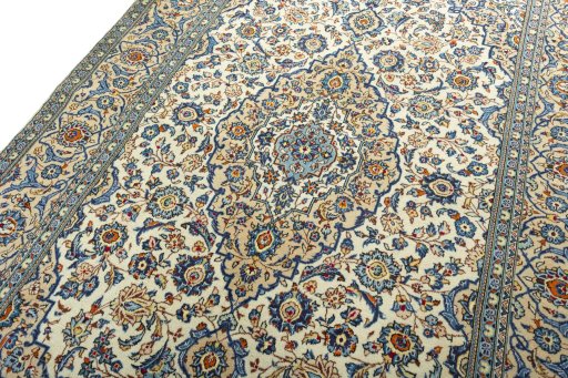 Backside of handmade 2000s Kashan rug showing knot structure and weave density