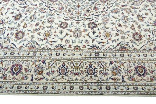 Corner detail of 2000s Kashan rug showing border pattern and Wool pile