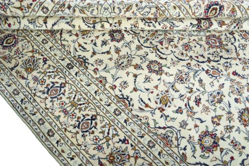 Close-up detail of 2000s Kashan rug from Iran / Persia showing Wool weave