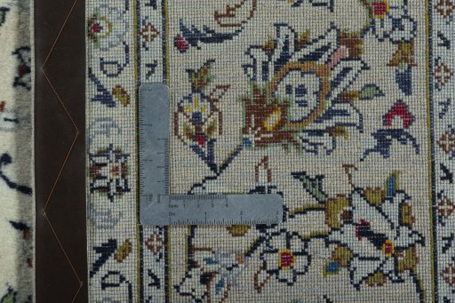 Backside of handmade 2000s Kashan rug showing knot structure and weave density