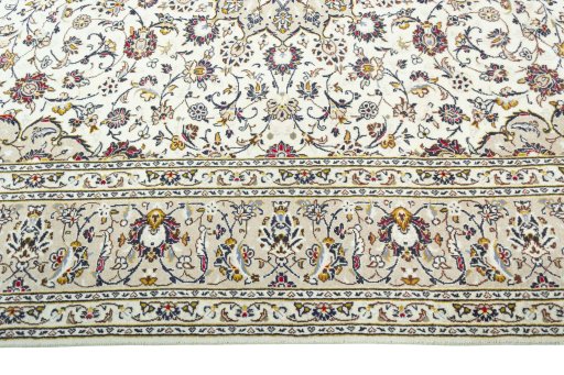 Corner detail of 2000s Kashan rug showing border pattern and Wool pile
