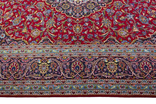 Corner detail of 2000s Kashan rug showing border pattern and Wool pile