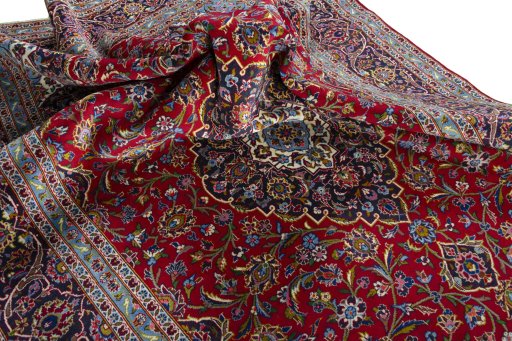 Surface texture of 2000s Kashan rug with natural Wool and intricate pattern