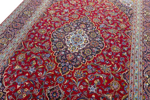 Backside of handmade 2000s Kashan rug showing knot structure and weave density