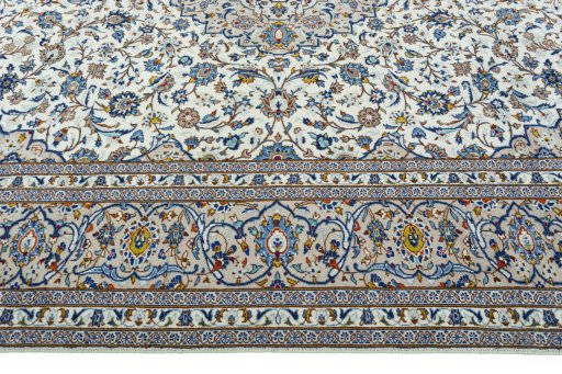 Corner detail of 1970s Kashan rug showing border pattern and Wool pile