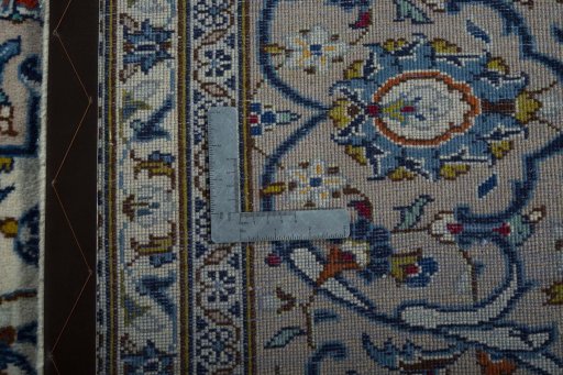 Backside of handmade 1970s Kashan rug showing knot structure and weave density