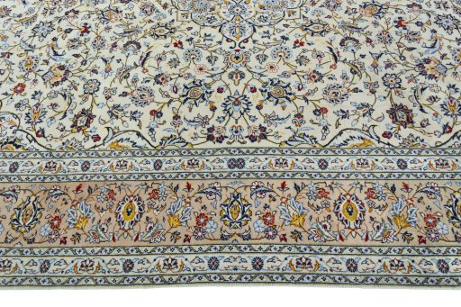 Corner detail of 2000s Kashan rug showing border pattern and Wool pile