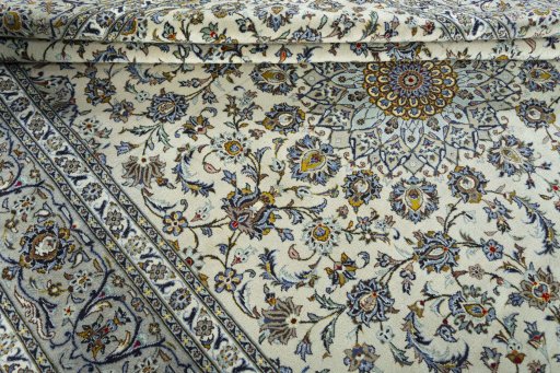 Close-up detail of 2000s Kashan rug from Iran / Persia showing Wool weave