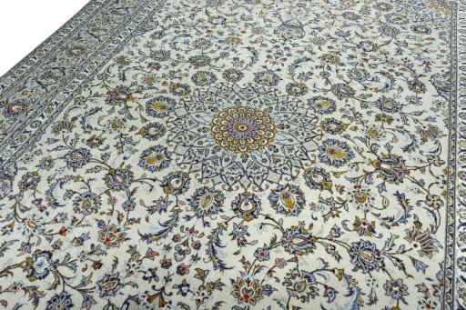 Backside of handmade 2000s Kashan rug showing knot structure and weave density