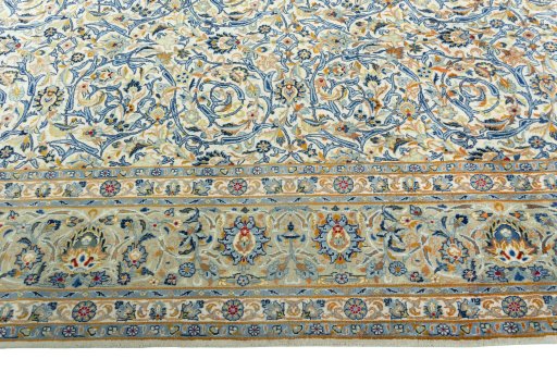 Corner detail of 2000s Kashan rug showing border pattern and Wool pile