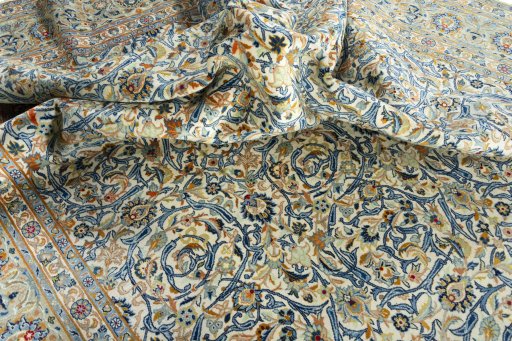 Surface texture of 2000s Kashan rug with natural Wool and intricate pattern