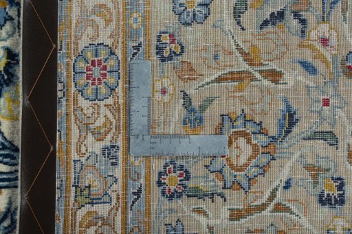 Backside of handmade 2000s Kashan rug showing knot structure and weave density