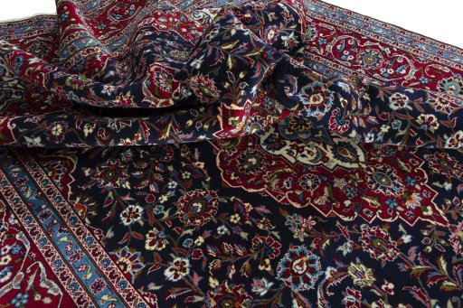 Surface texture of 2000s Kashan rug with natural Wool and intricate pattern
