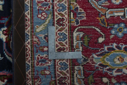 Backside of handmade 2000s Kashan rug showing knot structure and weave density