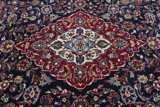 Central medallion detail of 2000s Kashan rug from Iran / Persia