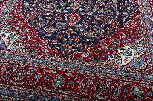 Close-up detail of 2000s Kashan rug from Iran / Persia showing Wool weave