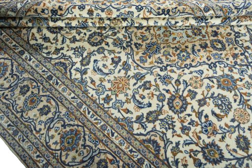 Close-up detail of 2000s Kashan rug from Iran / Persia showing Wool weave