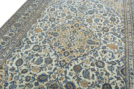 Backside of handmade 2000s Kashan rug showing knot structure and weave density