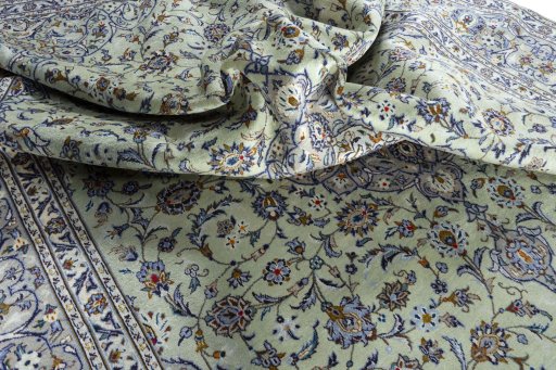 Surface texture of 2000s Kashan rug with natural Wool and intricate pattern