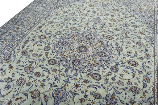 Backside of handmade 2000s Kashan rug showing knot structure and weave density