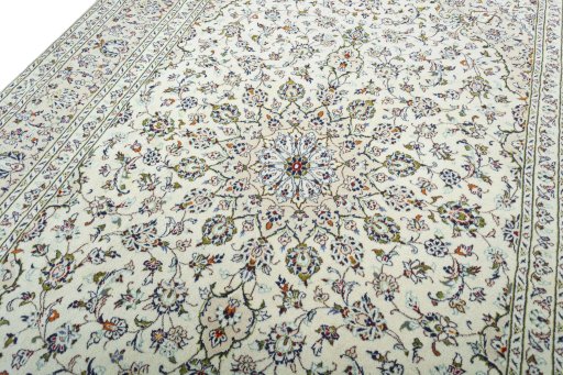 Backside of handmade 2000s Kashan rug showing knot structure and weave density