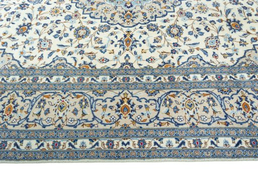 Corner detail of 2000s Kashan rug showing border pattern and Wool pile