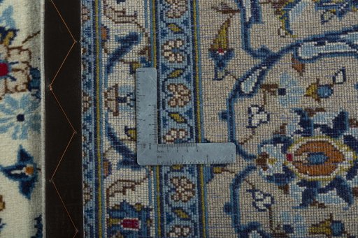 Backside of handmade 2000s Kashan rug showing knot structure and weave density