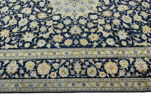 Corner detail of 2000s Kashan rug showing border pattern and Wool pile