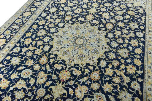 Backside of handmade 2000s Kashan rug showing knot structure and weave density