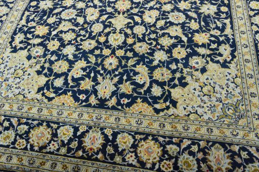 Close-up detail of 2000s Kashan rug from Iran / Persia showing Wool weave