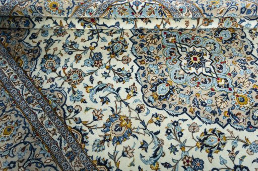 Close-up detail of 2000s Kashan rug from Iran / Persia showing Wool weave
