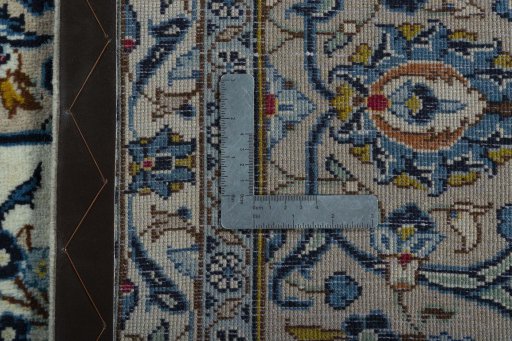 Backside of handmade 2000s Kashan rug showing knot structure and weave density