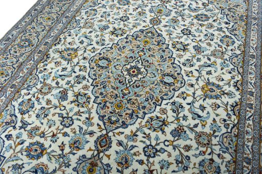 Backside of handmade 2000s Kashan rug showing knot structure and weave density