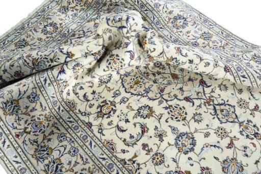 Surface texture of 2000s Kashan rug with natural Wool and intricate pattern