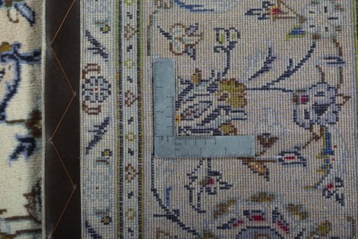 Backside of handmade 2000s Kashan rug showing knot structure and weave density