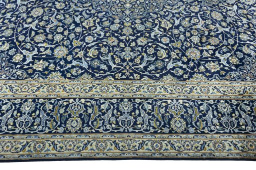 Corner detail of 2000s Kashan rug showing border pattern and Wool pile